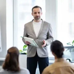 How Motivational Speakers Can Improve Workplace Motivation and Team Spirit